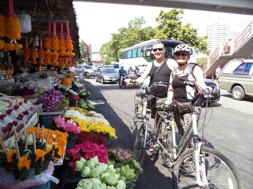 Chiang Mai City Culture Bicycle Ride - Crossing the river to a local market: snack time with context