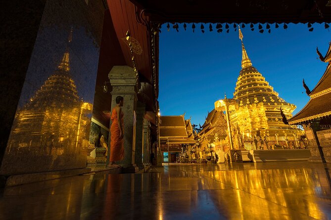 Doi Suthep and Wat Umong Night Tour From Chiang Mai - Wat Phrathat Doi Suthep at night: 306 steps, Naga stairs, and golden pagoda glow