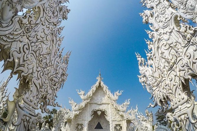 From Chiang Mai: White and Blue Temple & Golden Triangle Day Trip - Mekong River Boat Trip: The Break Your Legs (and Mind) Deserve
