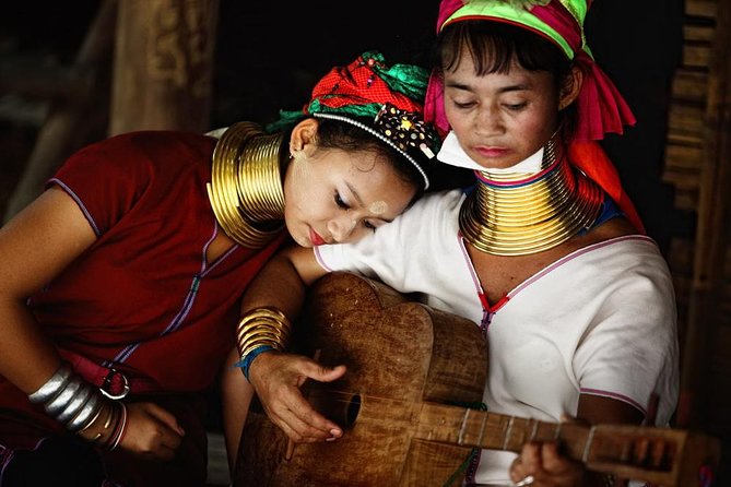 One Day Tour Doi Suthep Temple, Palad Temple, Orchid Farm, Longneck hill tribe village (Private tour) - Wat Phra That Doi Suthep: golden chedi, mountain views, and temple etiquette