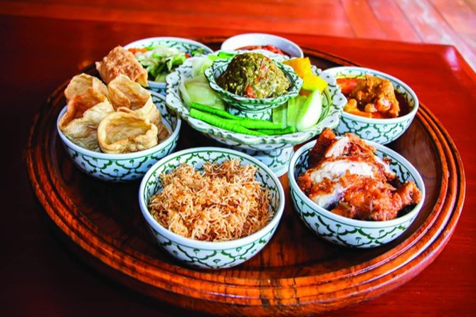 Traditional Khum Khantoke Dinner from Chiang Mai with Cultural Dance Show - Khantoke dinner at low toke tables: the real Lanna feel